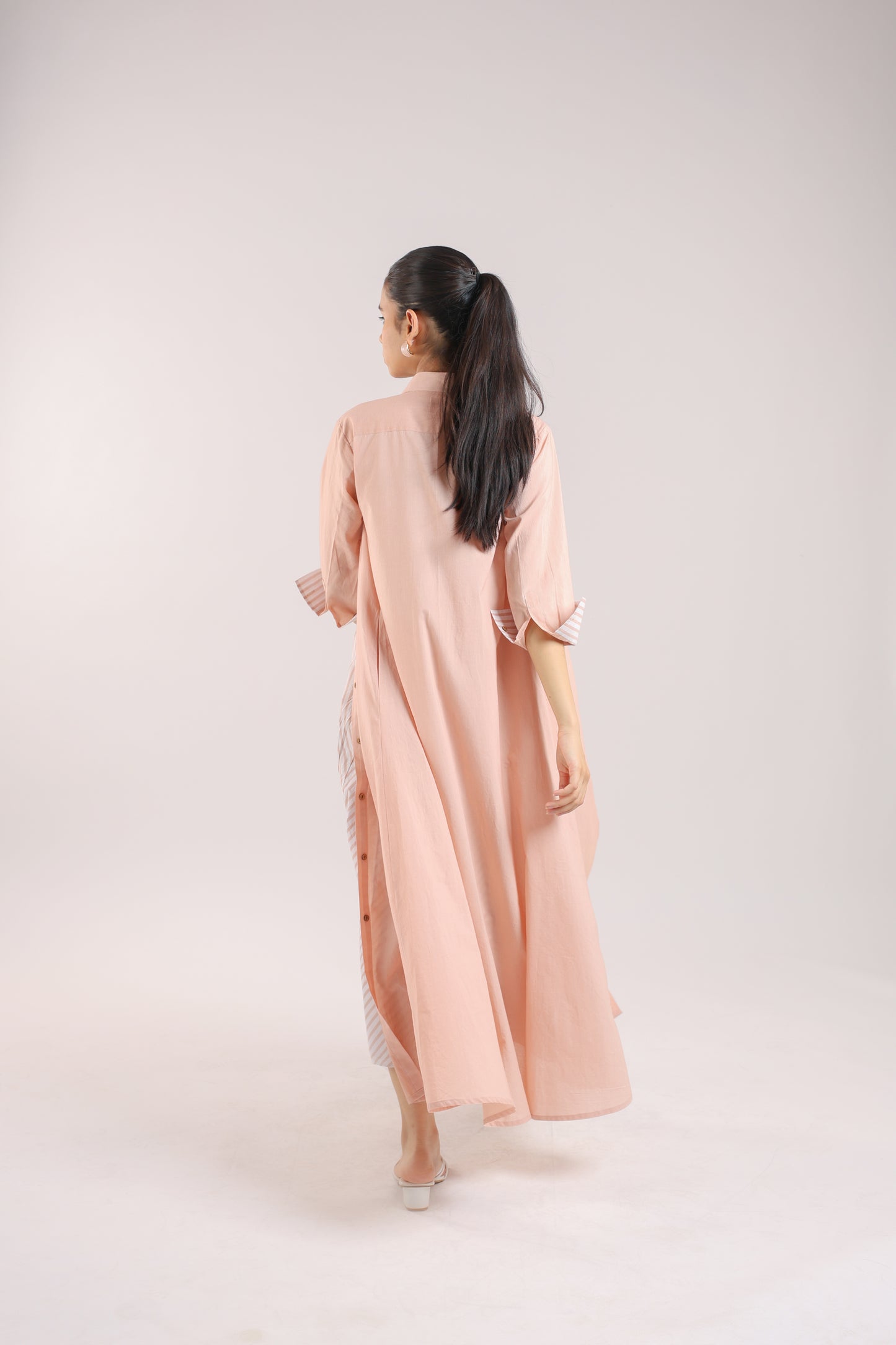 Nude Pink Shirt dress paired with a striped slip