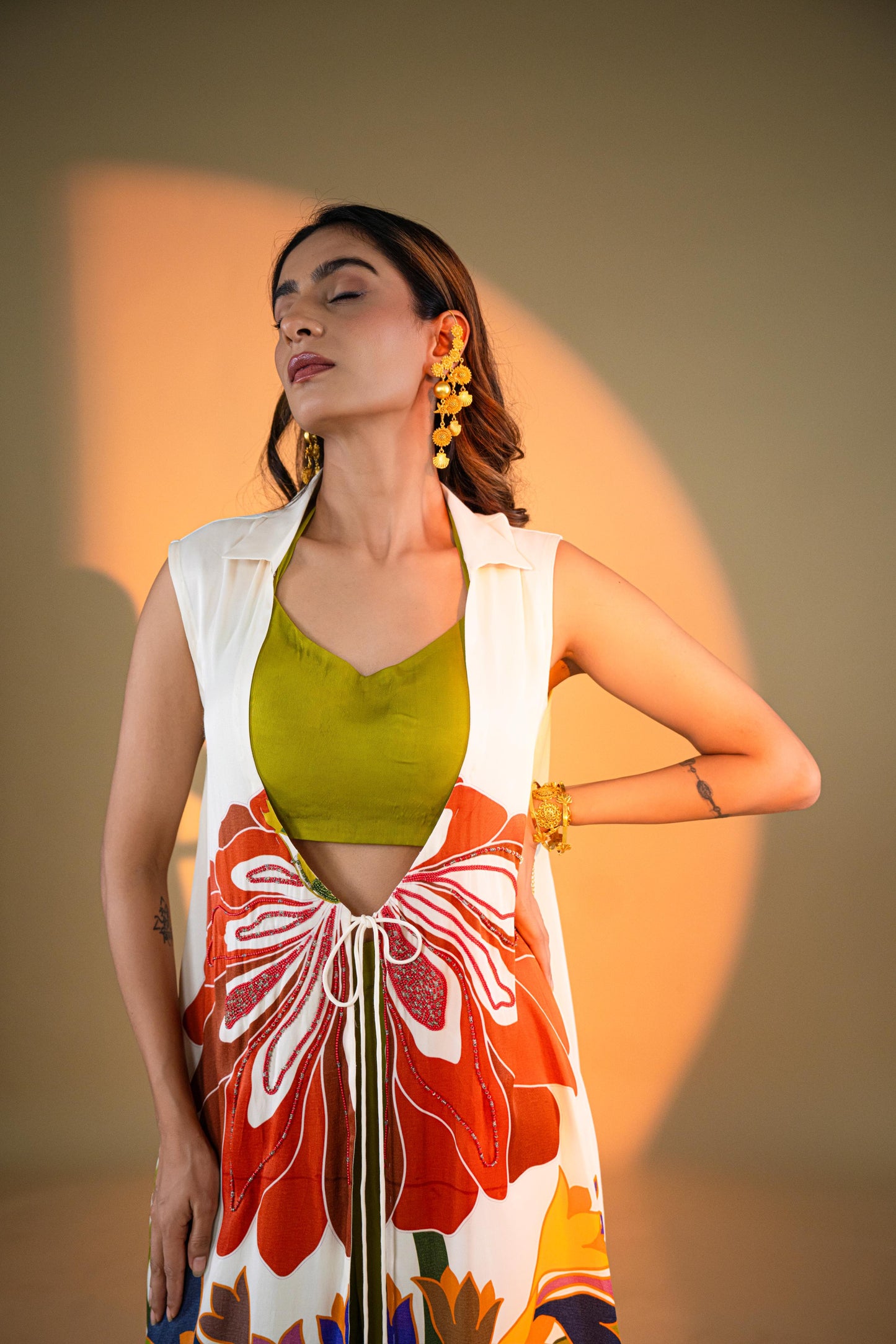 Off-White Sleeveless Kurta Set with Floral Embroidery & Green Flared Pants