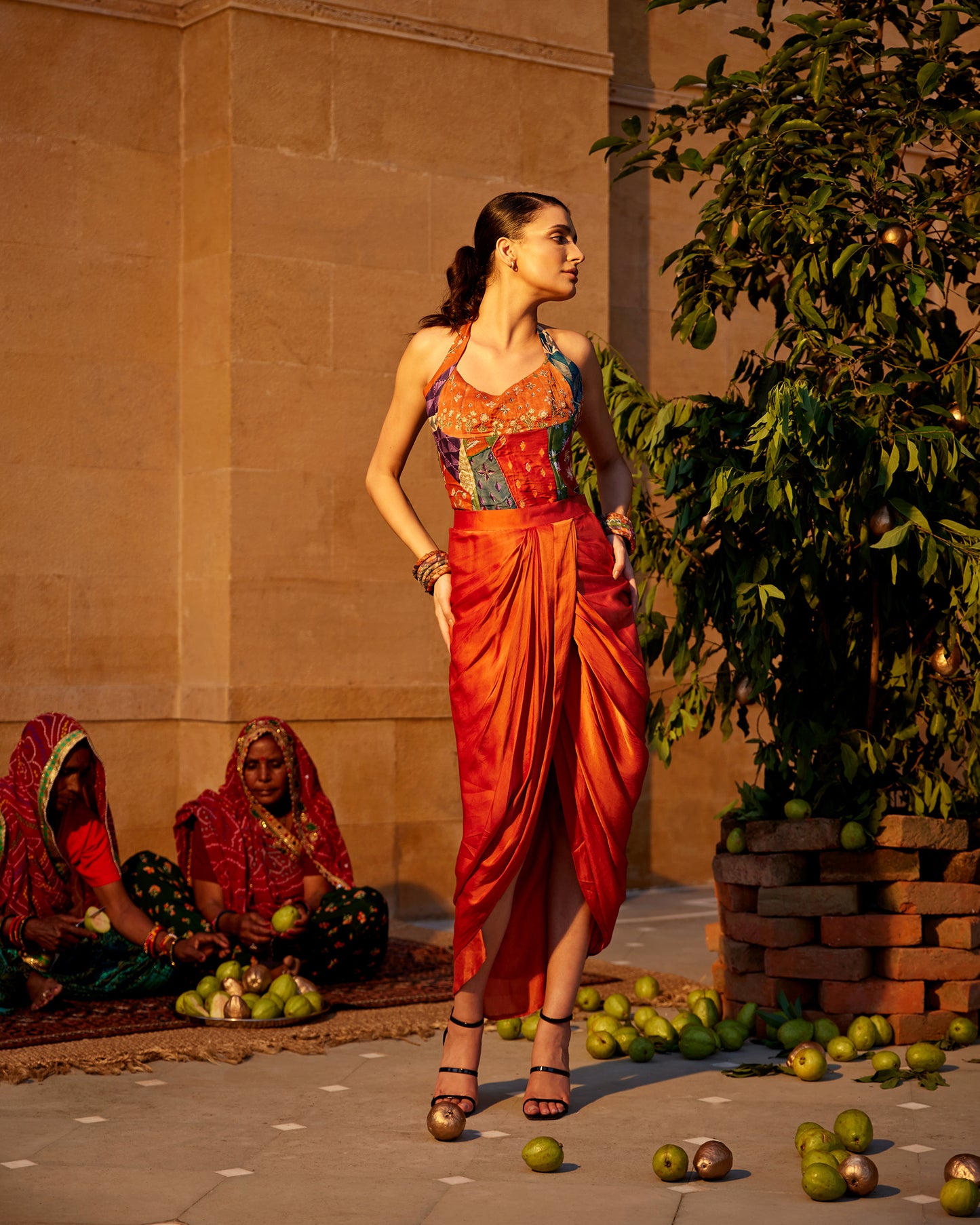Burnt orange satin drape skirt paired with a hand-block highlighting corset for women