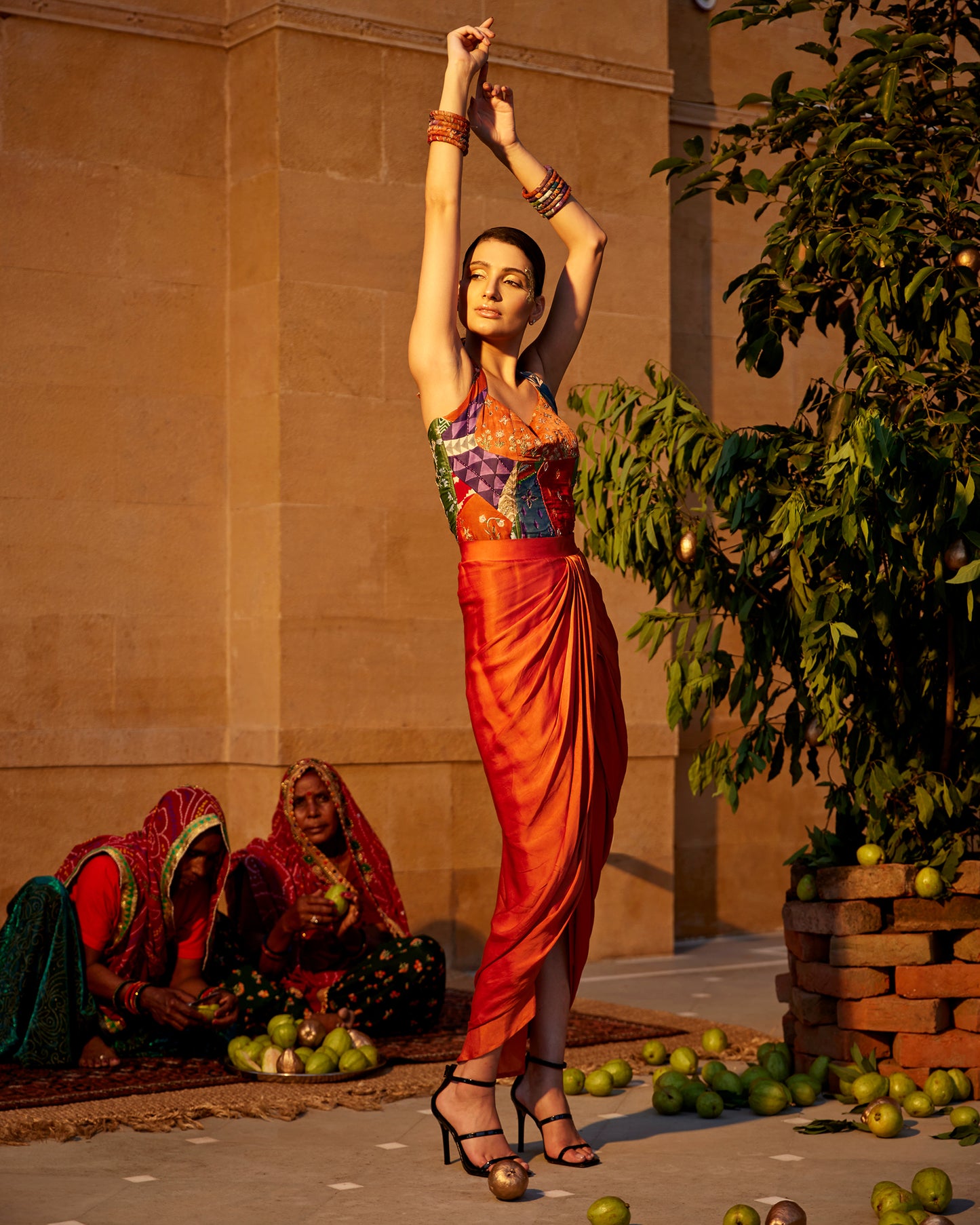 Burnt orange satin drape skirt paired with a hand-block highlighting corset for women