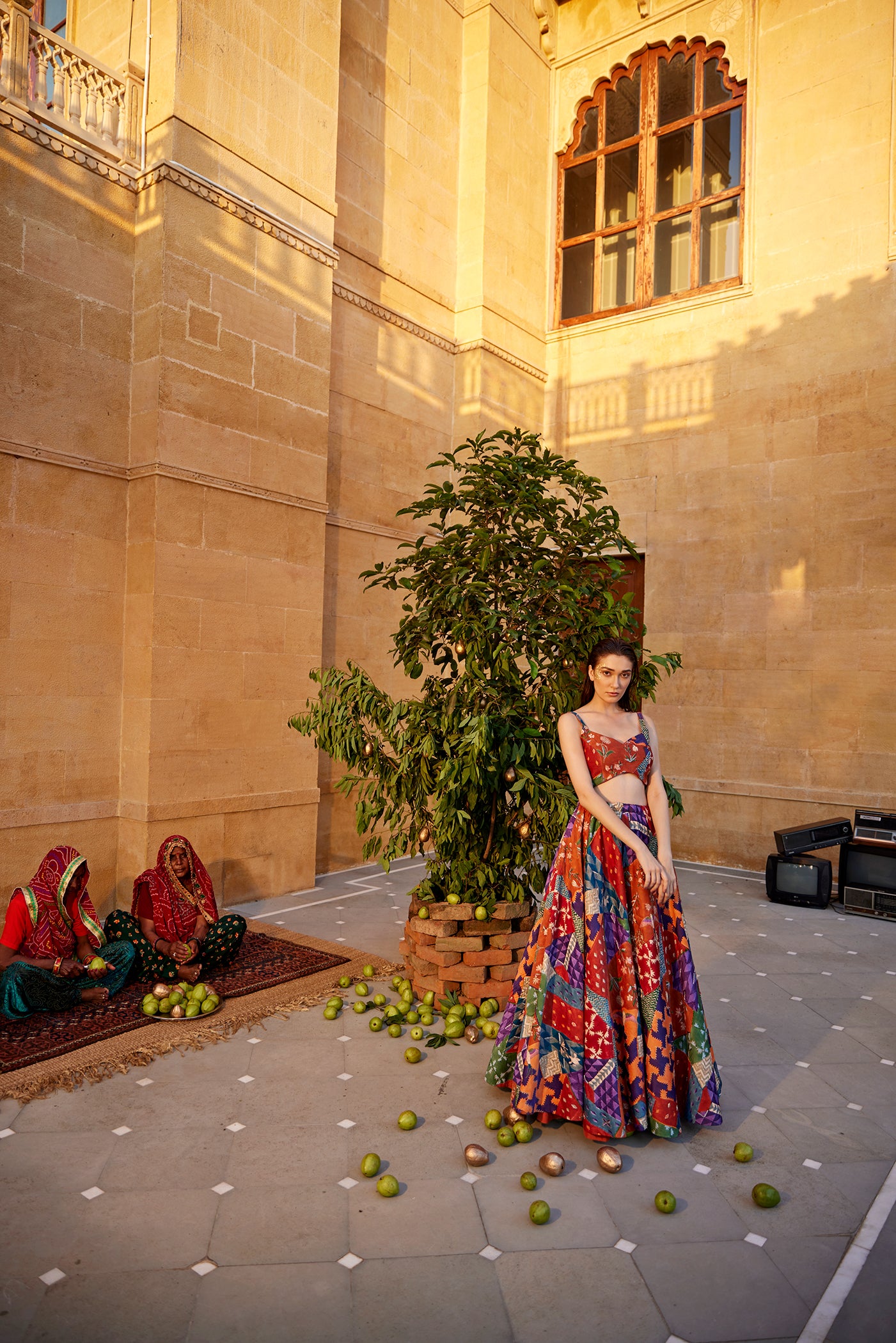 Burnt orange hand-block highlighted lehenga set paired with a blouse and dupatta for women