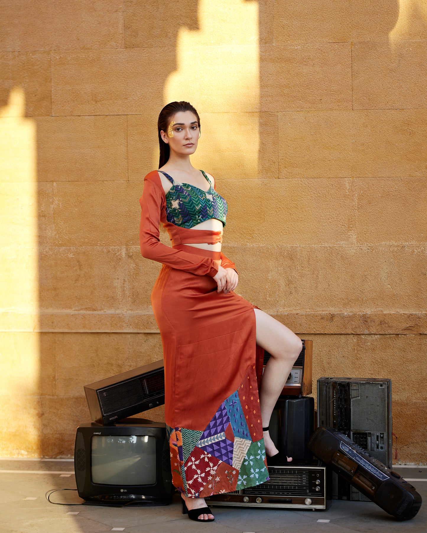 Burnt orange hand-block patched skirt paired with a jacket and highlighted blouse for women.