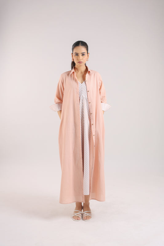 Nude Pink Shirt dress paired with a striped slip