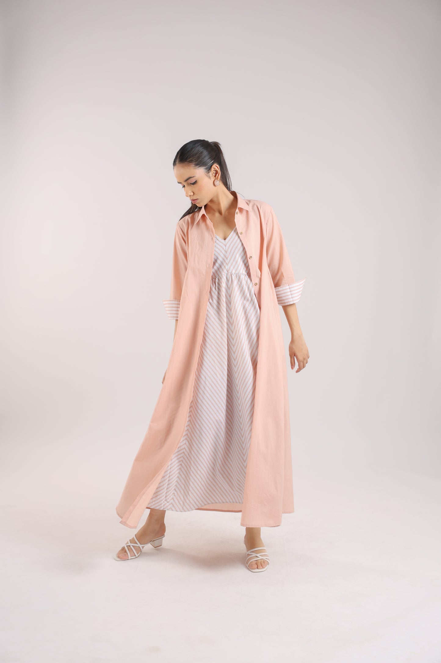Nude Pink Shirt dress paired with a striped slip