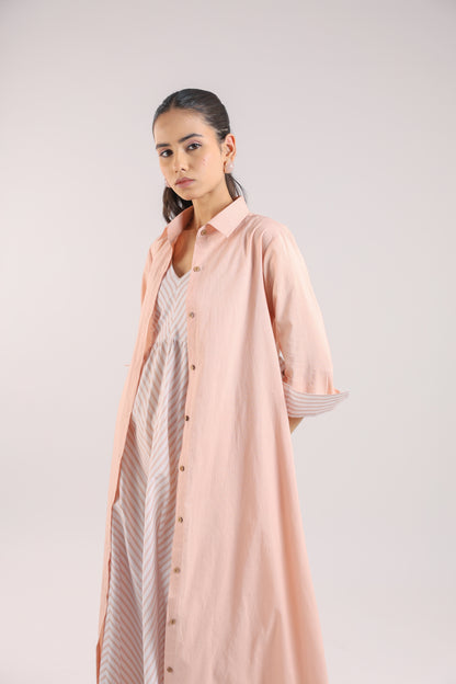 Nude Pink Shirt dress paired with a striped slip