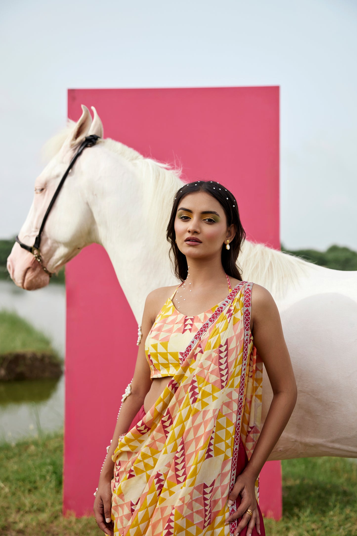 Yellow lehenga set paired with drape dupatta for women