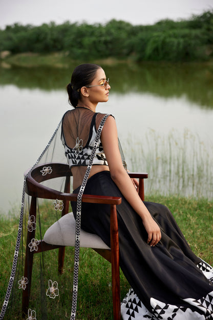 Black lehenga set with patched handblock border with an embroiderd cape in net for women