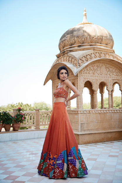 Burnt orange lehenga set with patched hand block border with an highlighted blouse for women