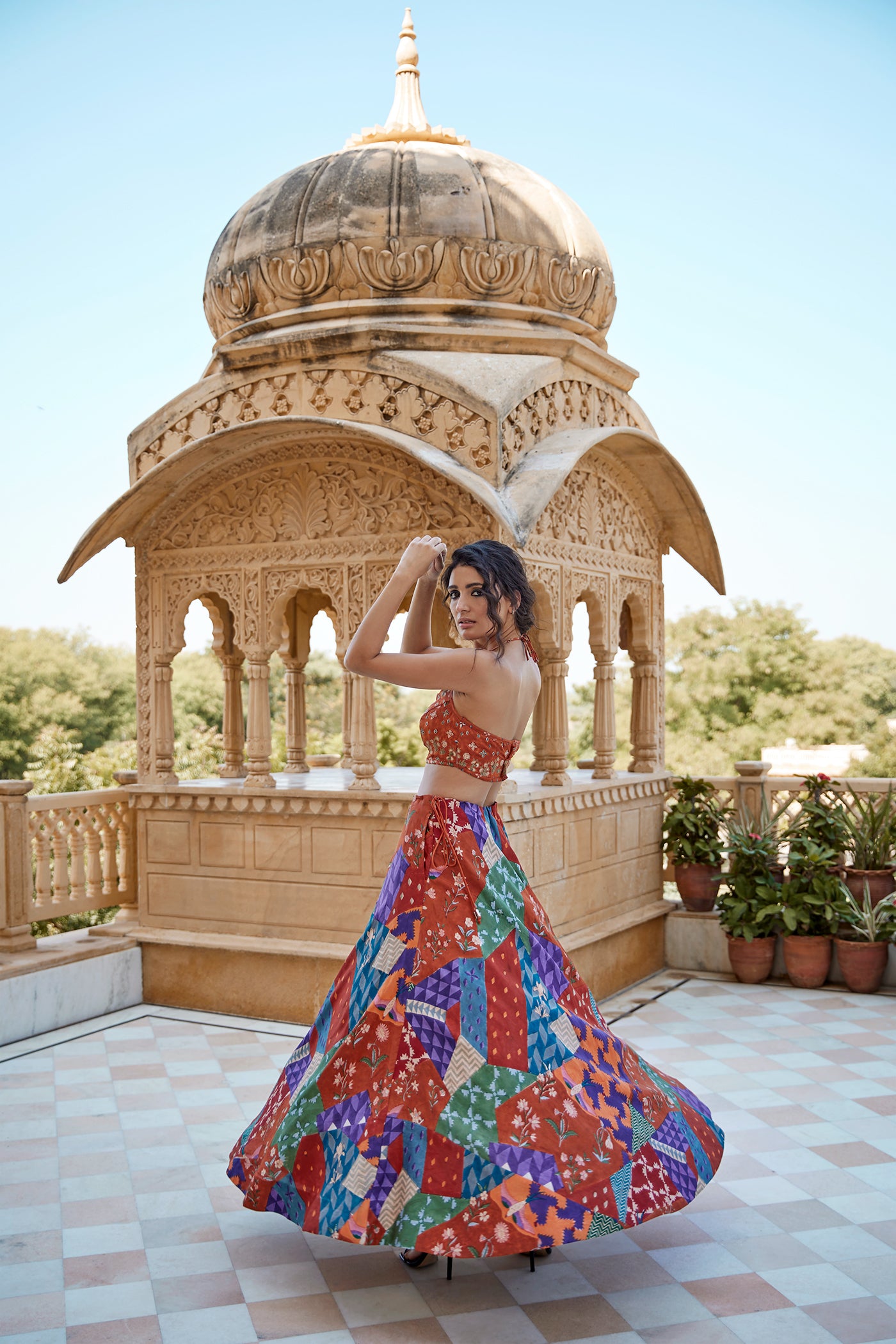 Burnt orange satin hand block lehenga set paired with a highlighted blouse for women