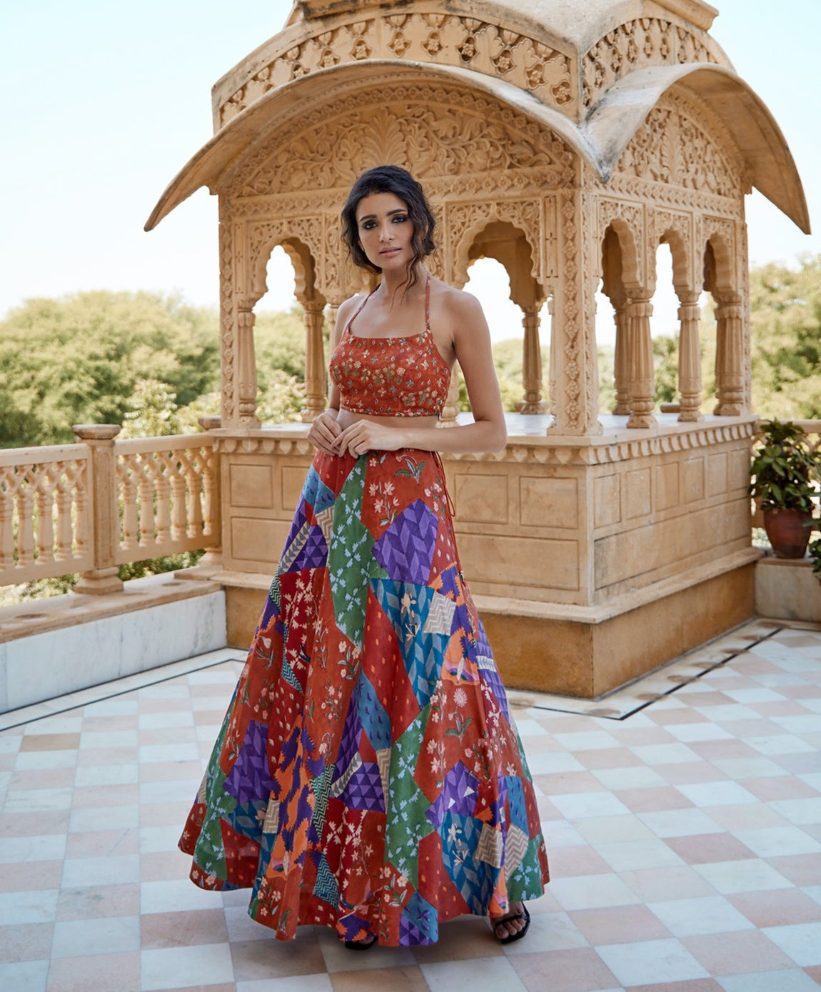 Burnt orange satin hand block lehenga set paired with a highlighted blouse for women