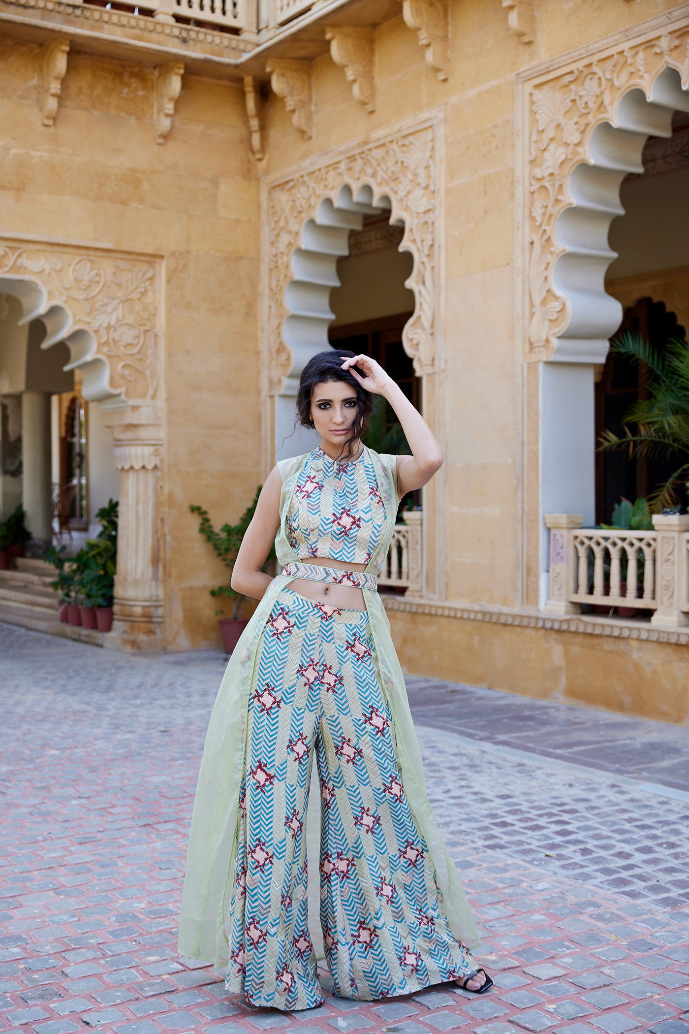 Pistachio hand-block printed palazzo pant set paired with a highlighted blouse, belt, and organza jacket for women