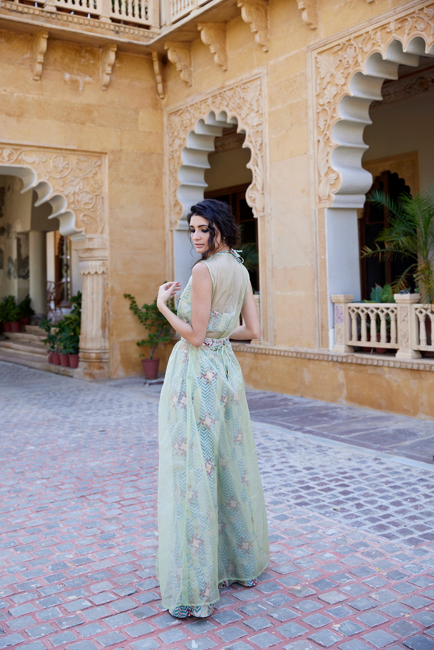 Pistachio hand-block printed palazzo pant set paired with a highlighted blouse, belt, and organza jacket for women