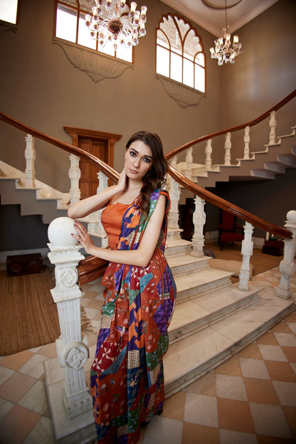 Burnt orange satin drape saree paired with corset for women