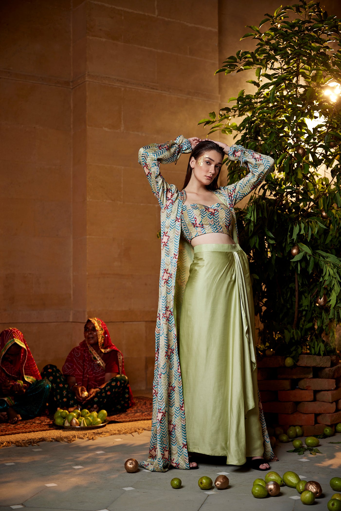 Pistachio drape skirt set paired with a hand block printed blouse & jacket with highlighting accents for women