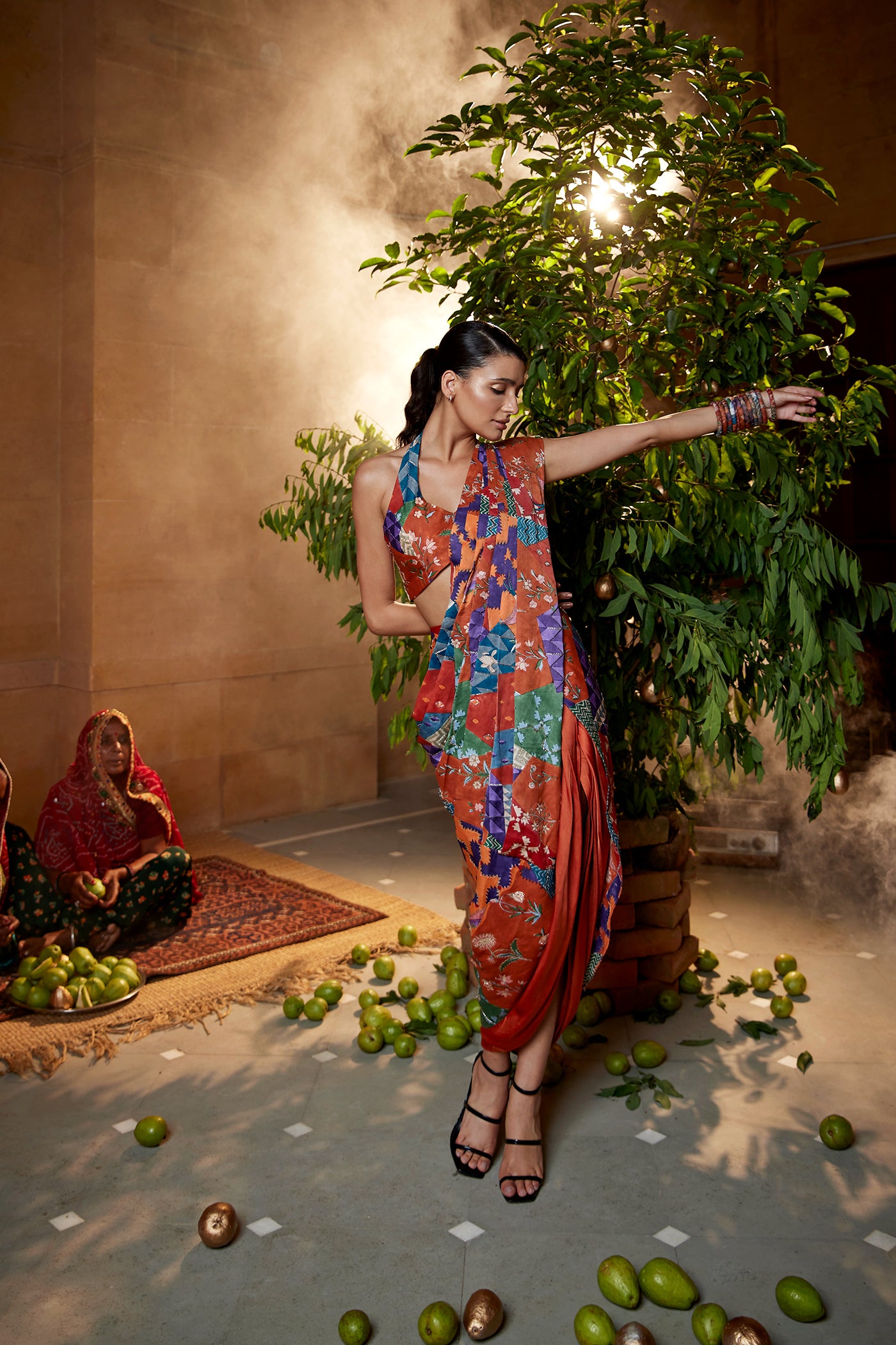 Burnt orange satin drape saree set paired with highlighted blouse for women